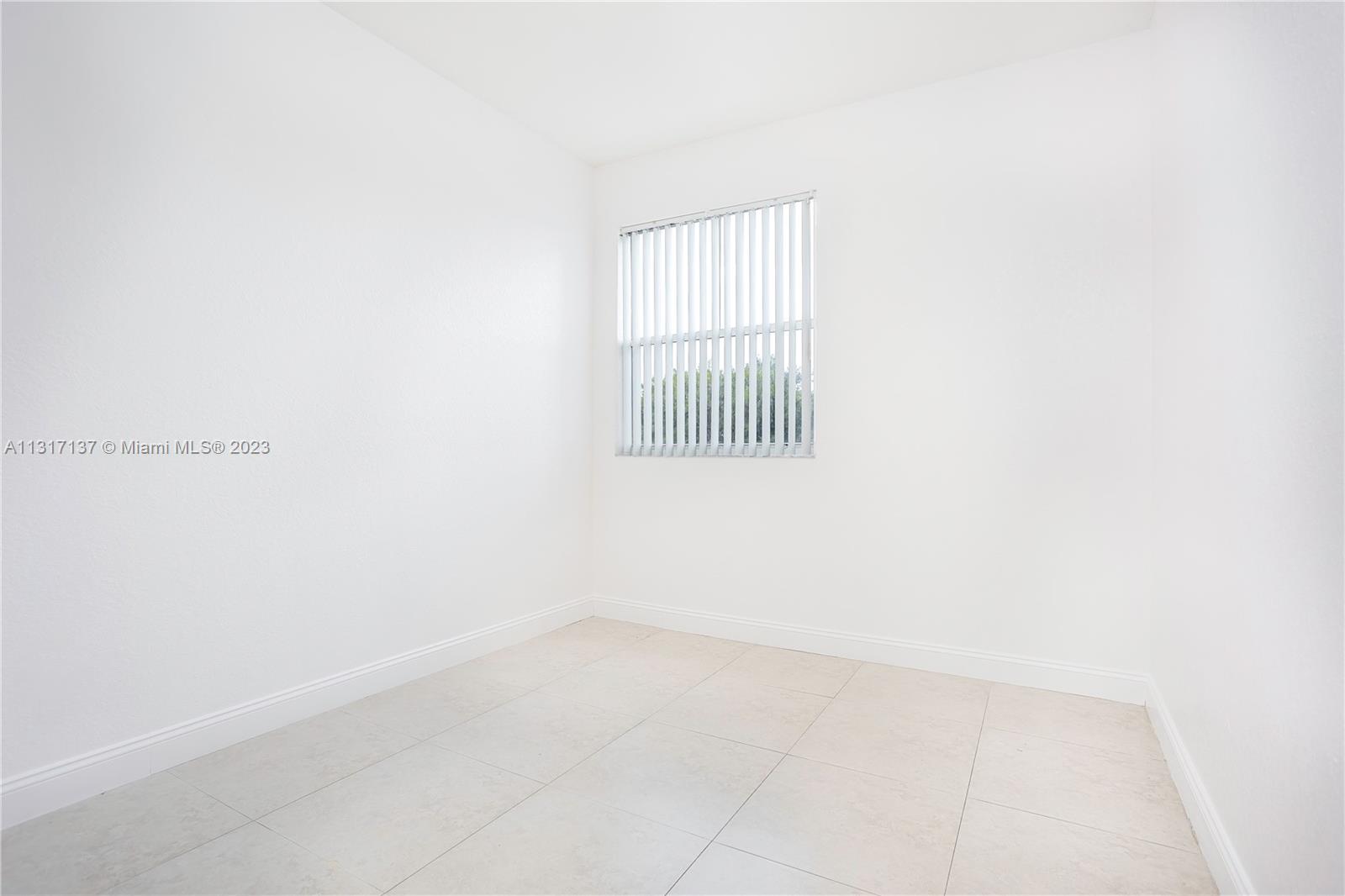 4971 Southwest 140th Terrace, Unit 6 Miramar, FL 33027 - Photo 15 of 24 a view of a window in a room