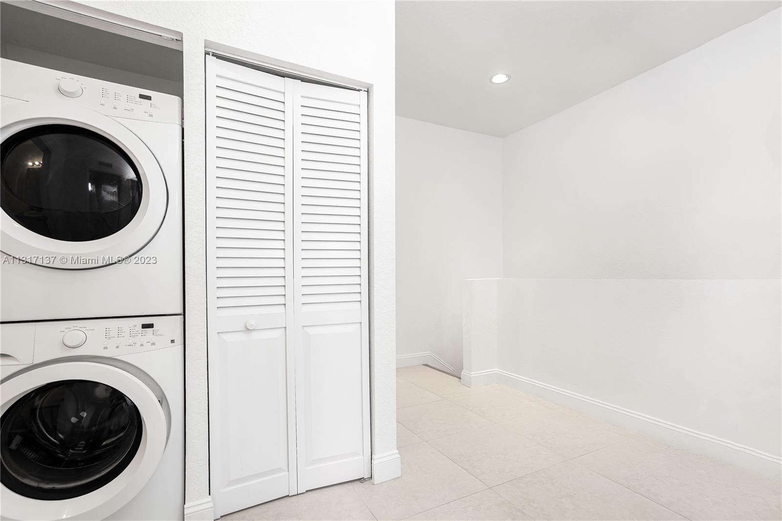 4971 Southwest 140th Terrace, Unit 6 Miramar, FL 33027 - Photo 16 of 24 a view of a hallway with washer and dryer