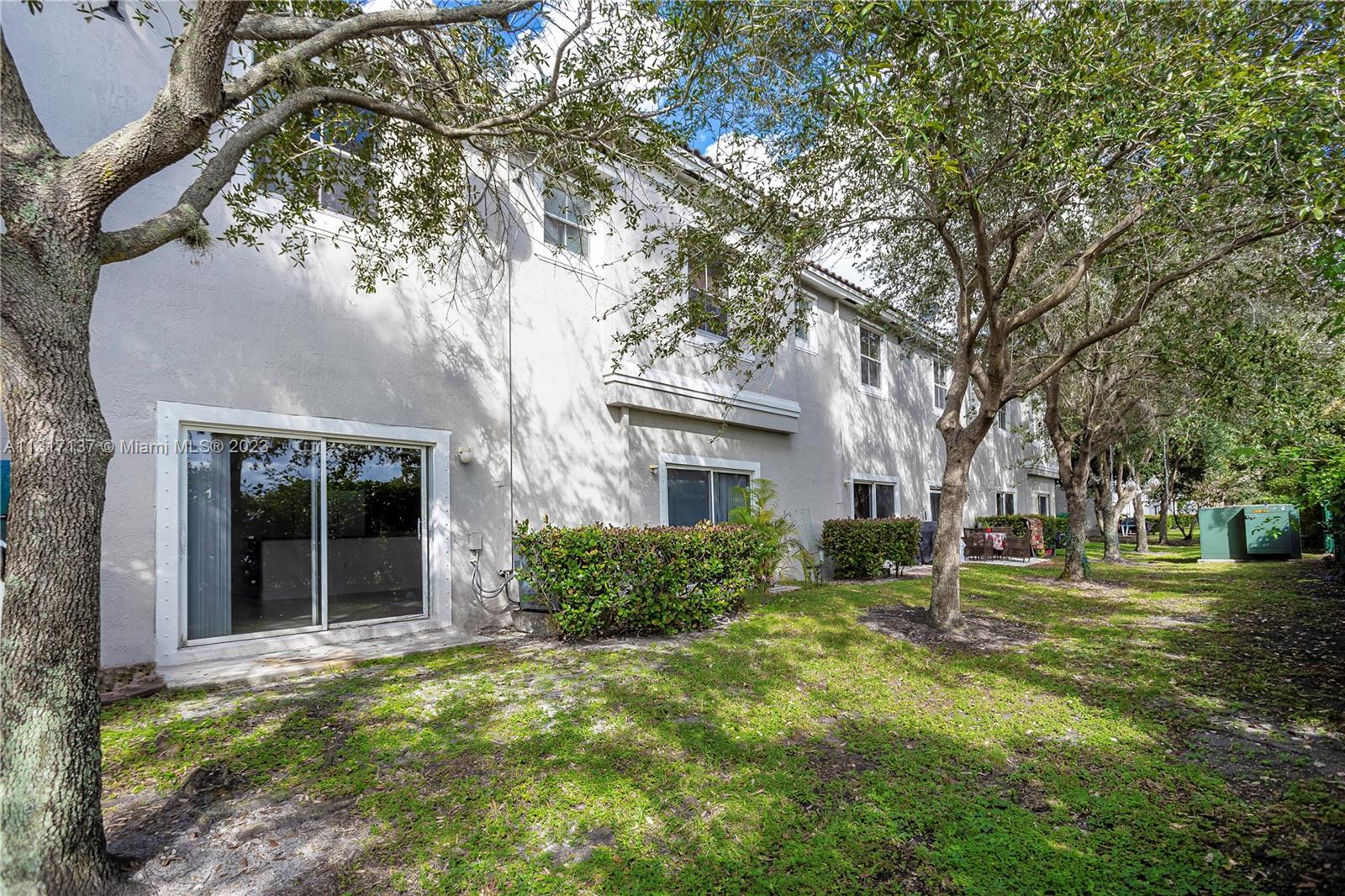 4971 Southwest 140th Terrace, Unit 6 Miramar, FL 33027 - Photo 18 of 24 a view of a yard in front of house