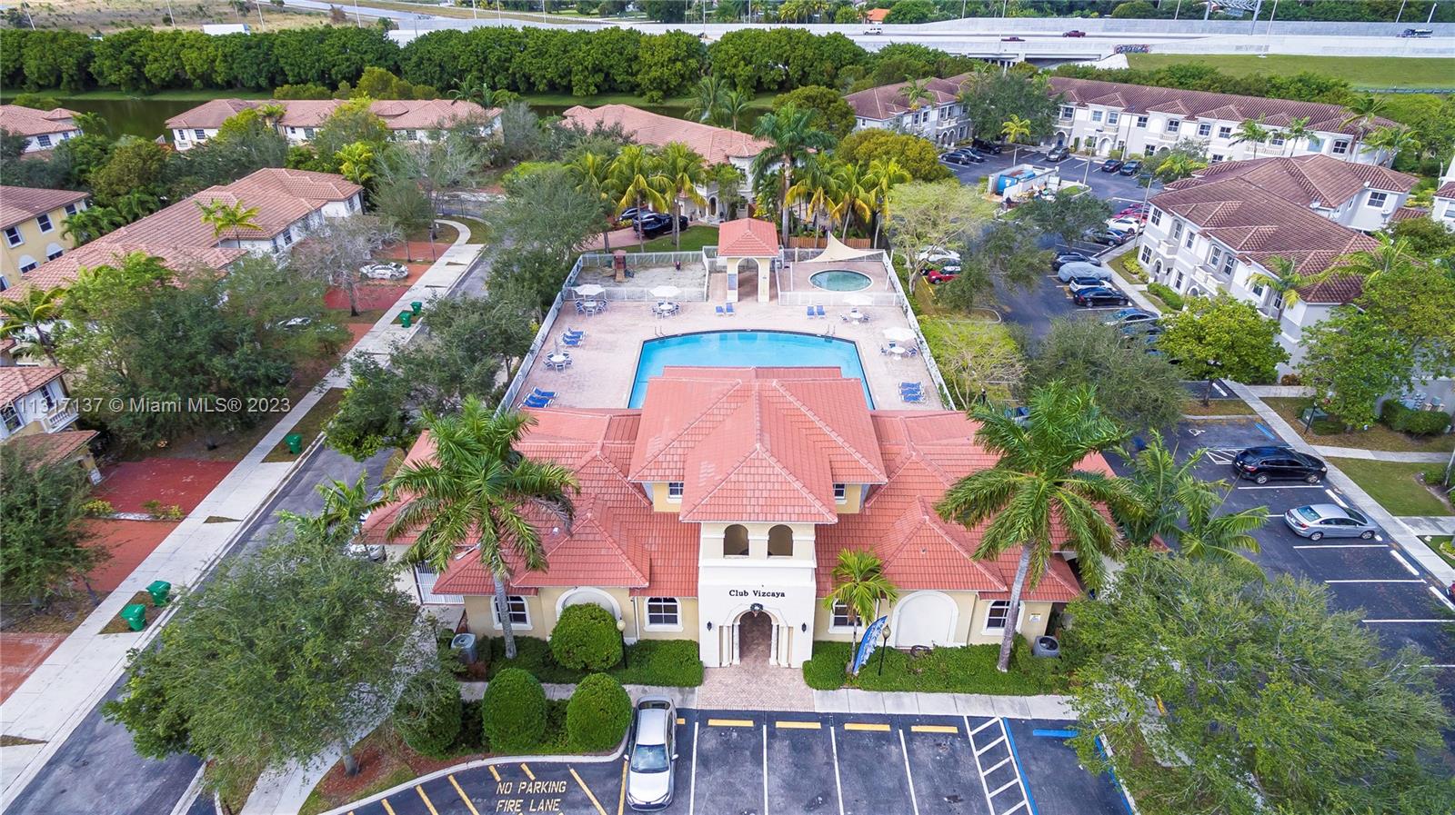 4971 Southwest 140th Terrace, Unit 6 Miramar, FL 33027 - Photo 20 of 24 an aerial view of residential house with outdoor space and swimming pool