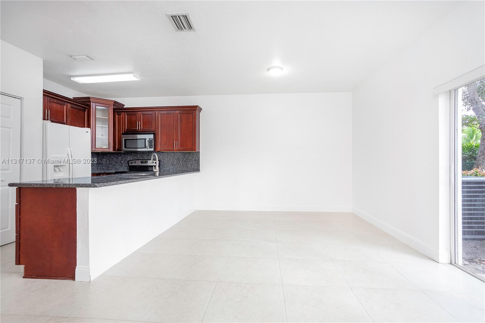 4971 Southwest 140th Terrace, Unit 6 Miramar, FL 33027 - Photo 7 of 24 a view of a kitchen with a sink