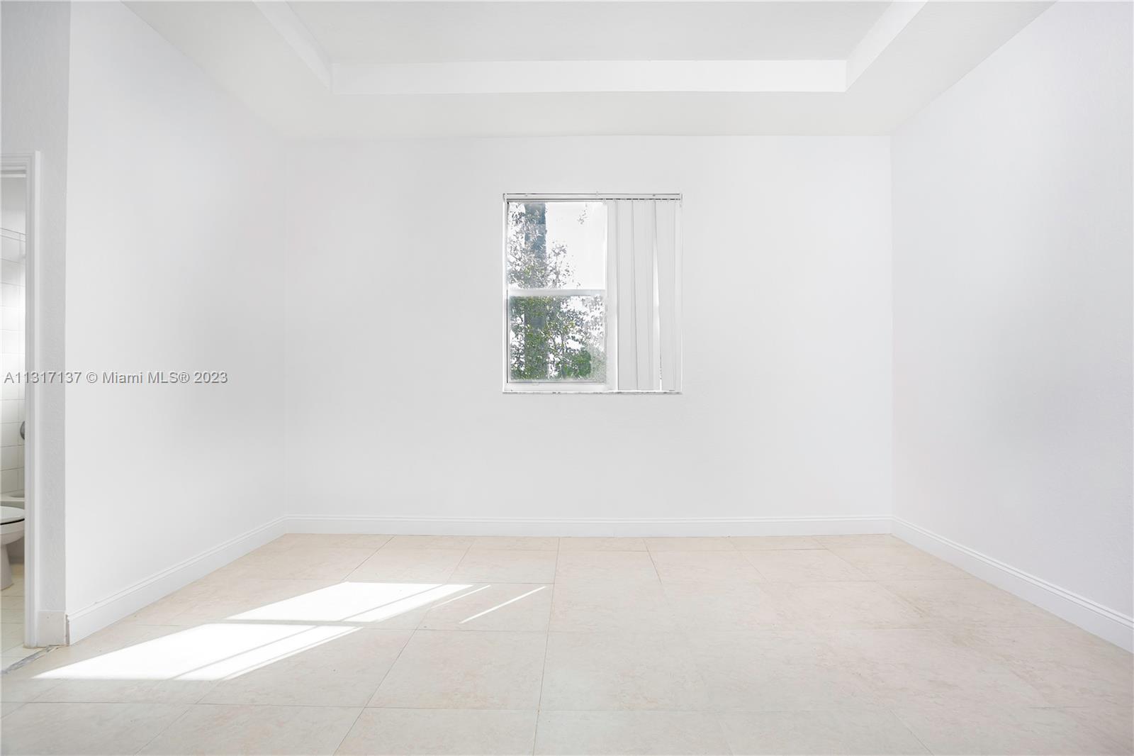 4971 Southwest 140th Terrace, Unit 6 Miramar, FL 33027 - Photo 10 of 24 an empty room with a window