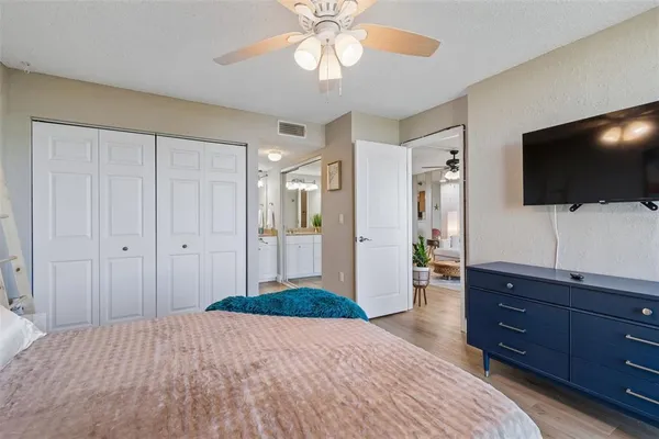 a front view of house with yard and trees in the background