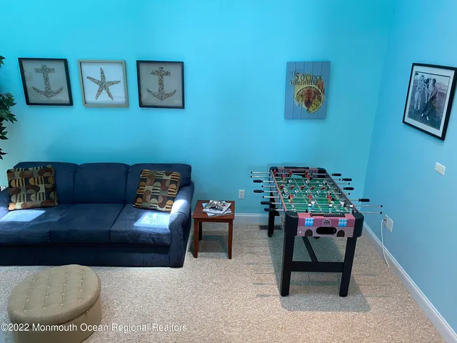 a room with a chair and a flat screen tv