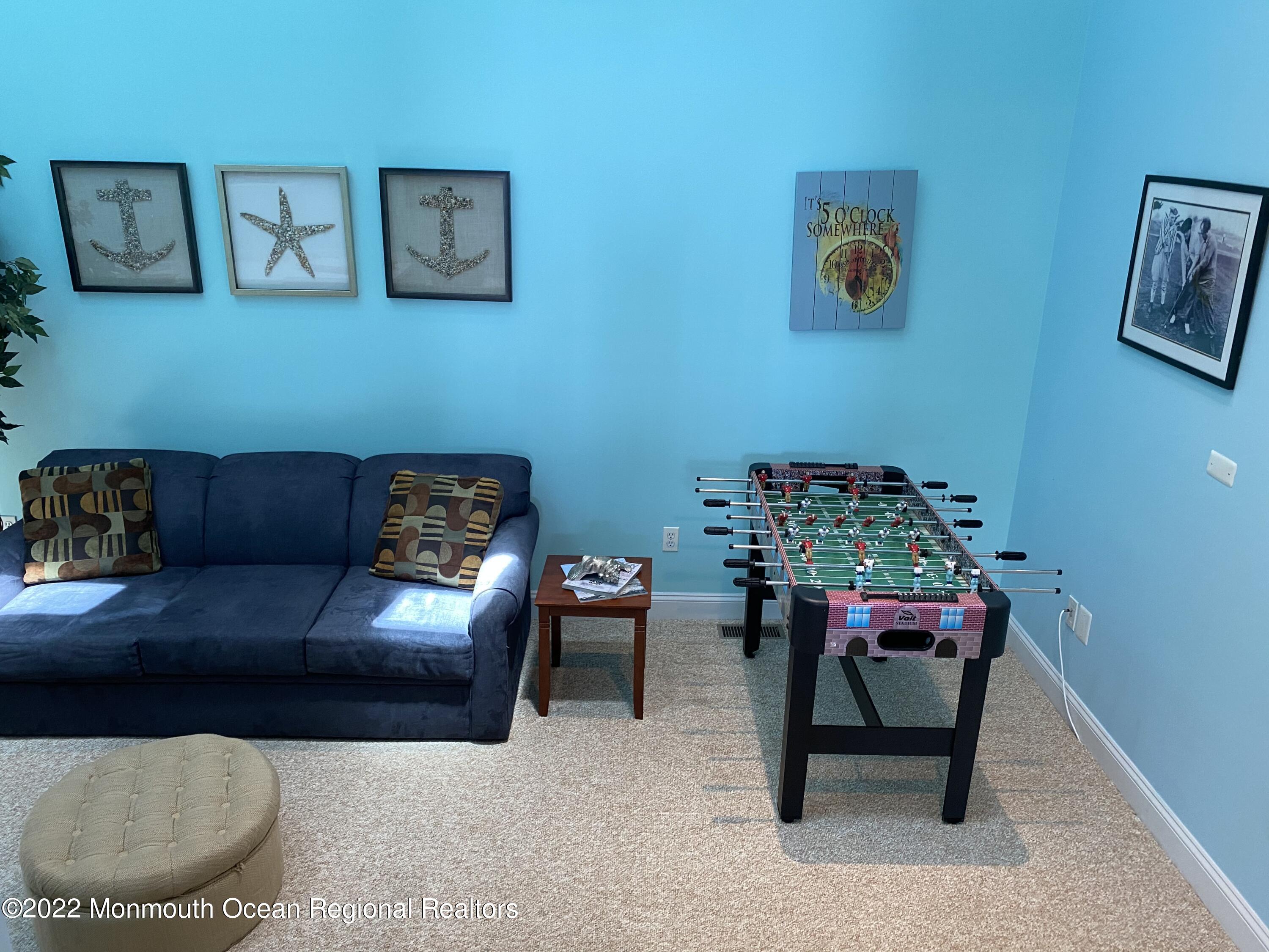 15 Sumner Avenue, Unit 12 Seaside Heights, NJ 08751 - Photo 12 of 24 a living room with furniture and a couch