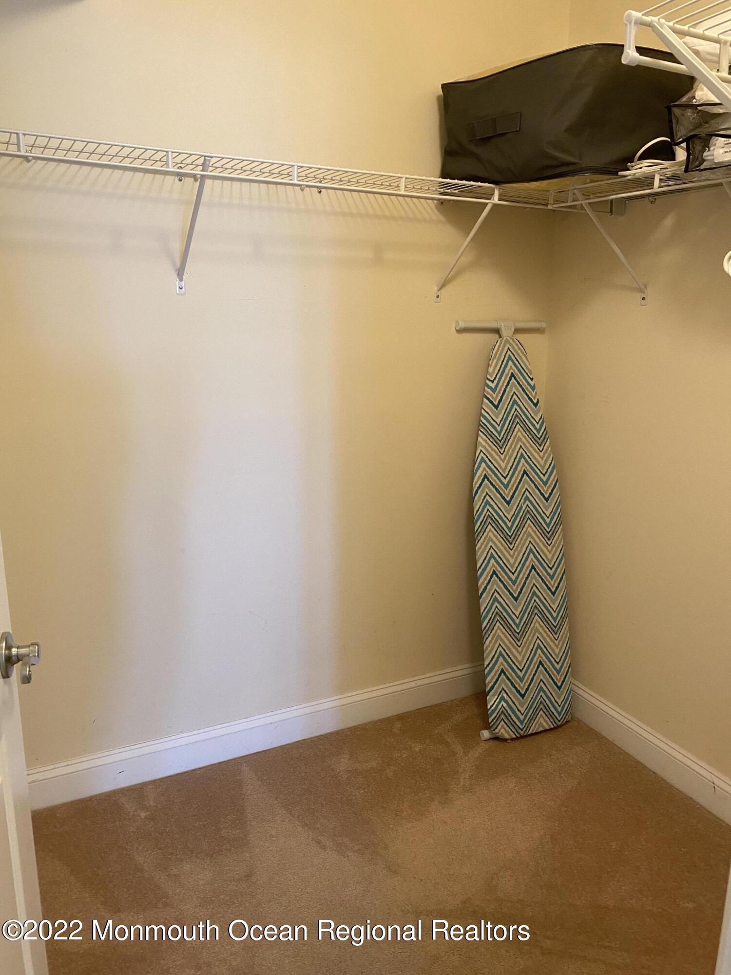 15 Sumner Avenue, Unit 12 Seaside Heights, NJ 08751 - Photo 17 of 24 a view of a room with racks on the wall