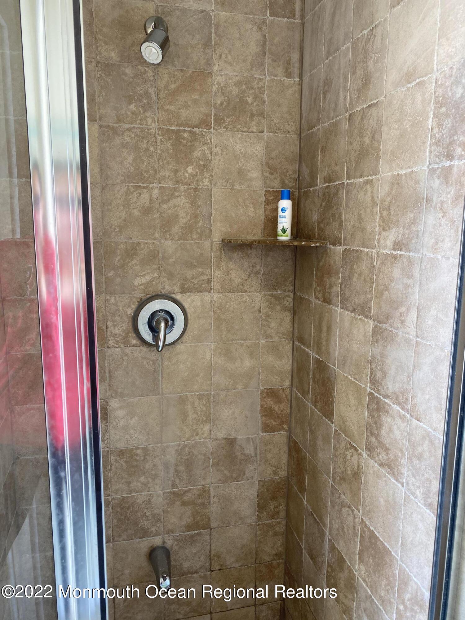 15 Sumner Avenue, Unit 12 Seaside Heights, NJ 08751 - Photo 23 of 24 a bathroom with a shower