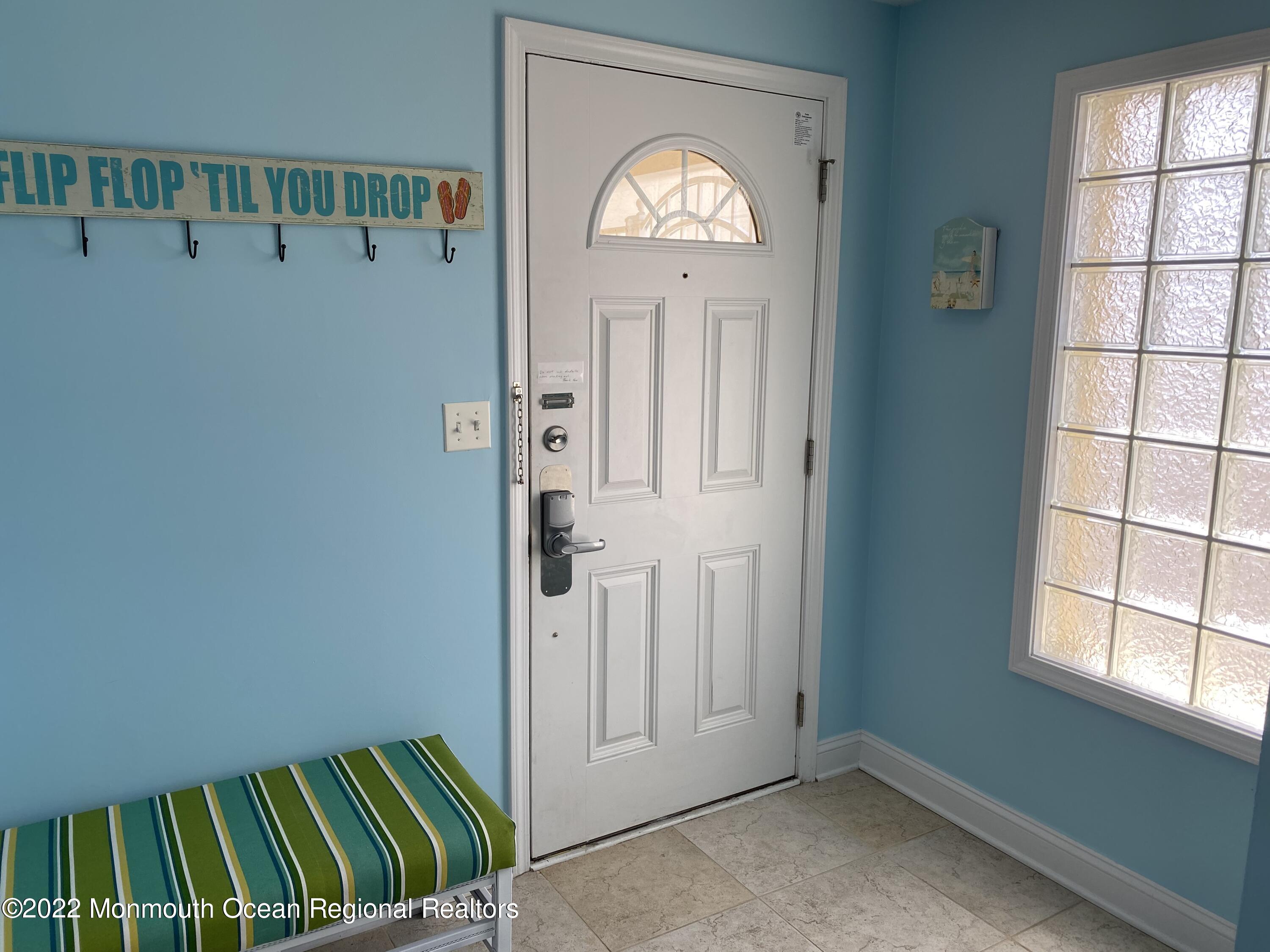 15 Sumner Avenue, Unit 12 Seaside Heights, NJ 08751 - Photo 4 of 24 a view of a livingroom with wooden floor & a window