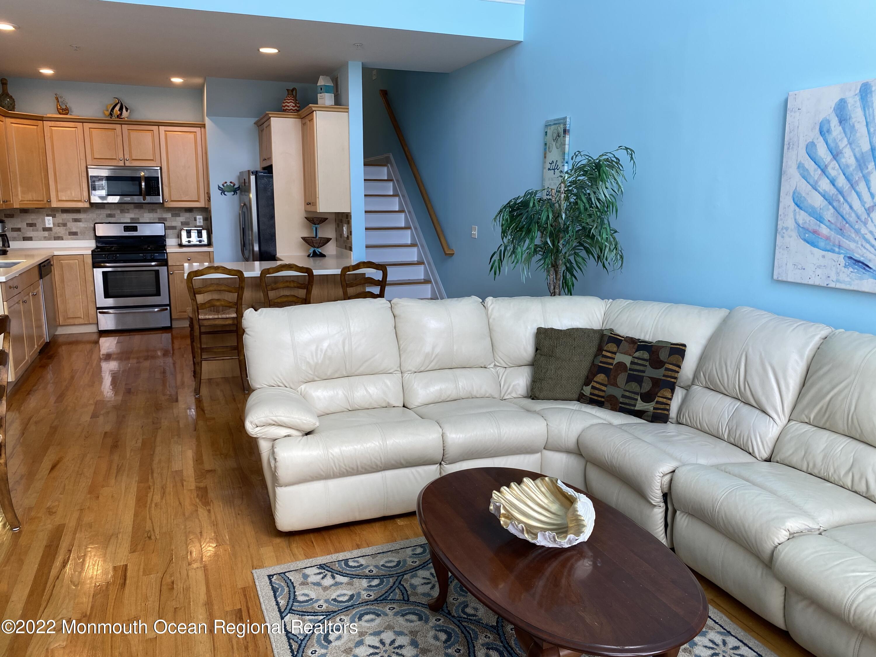 15 Sumner Avenue, Unit 12 Seaside Heights, NJ 08751 - Photo 8 of 24 a living room with furniture and wooden floor