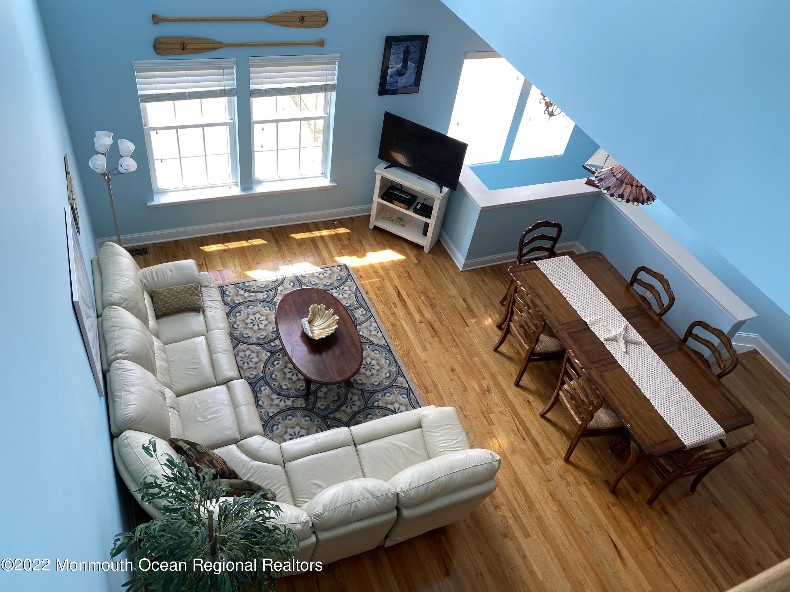 15 Sumner Avenue, Unit 12 Seaside Heights, NJ 08751 - Photo 9 of 24 a living room with furniture and a fireplace
