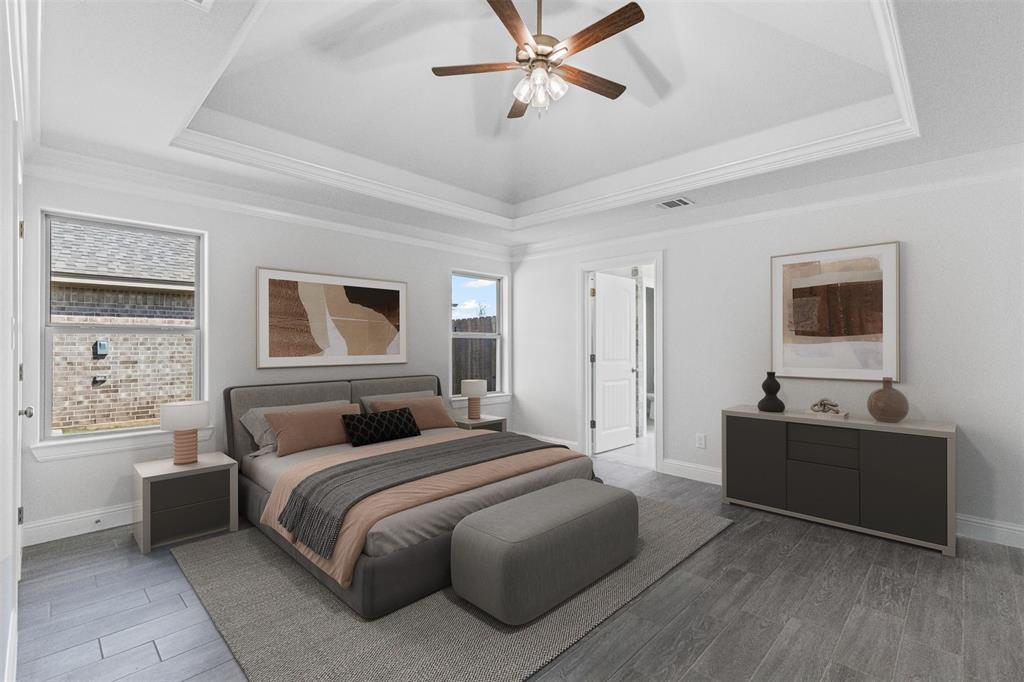 624 Jameson Springtown, TX 76082 - Photo 17 of 40 a bedroom with a bed and a flat screen tv