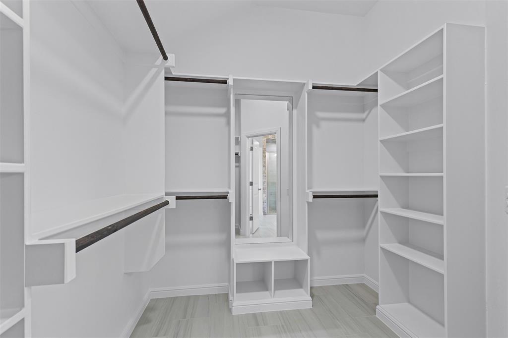 624 Jameson Springtown, TX 76082 - Photo 20 of 40 a view of walk in closet with empty racks