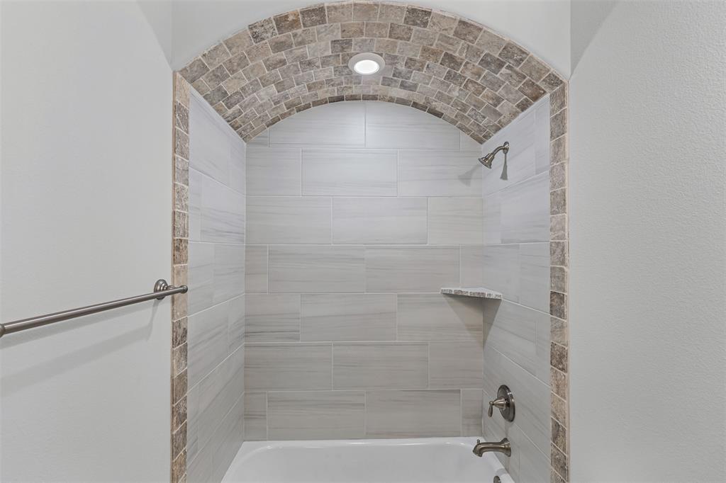 624 Jameson Springtown, TX 76082 - Photo 28 of 40 a bathroom with a sink and a shower