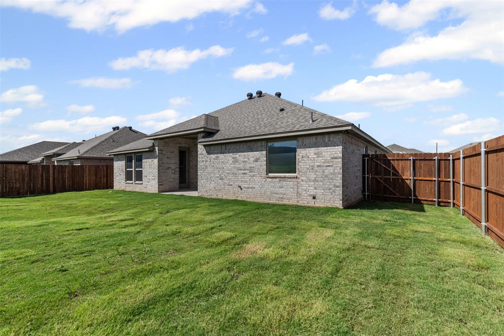 624 Jameson Springtown, TX 76082 - Photo 34 of 40 a view of a house with backyard