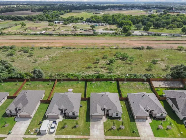 an aerial view of a house with a ocean view
