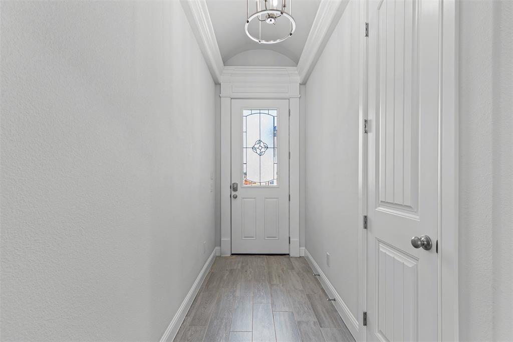 624 Jameson Springtown, TX 76082 - Photo 5 of 40 a view of a hallway with wooden floor
