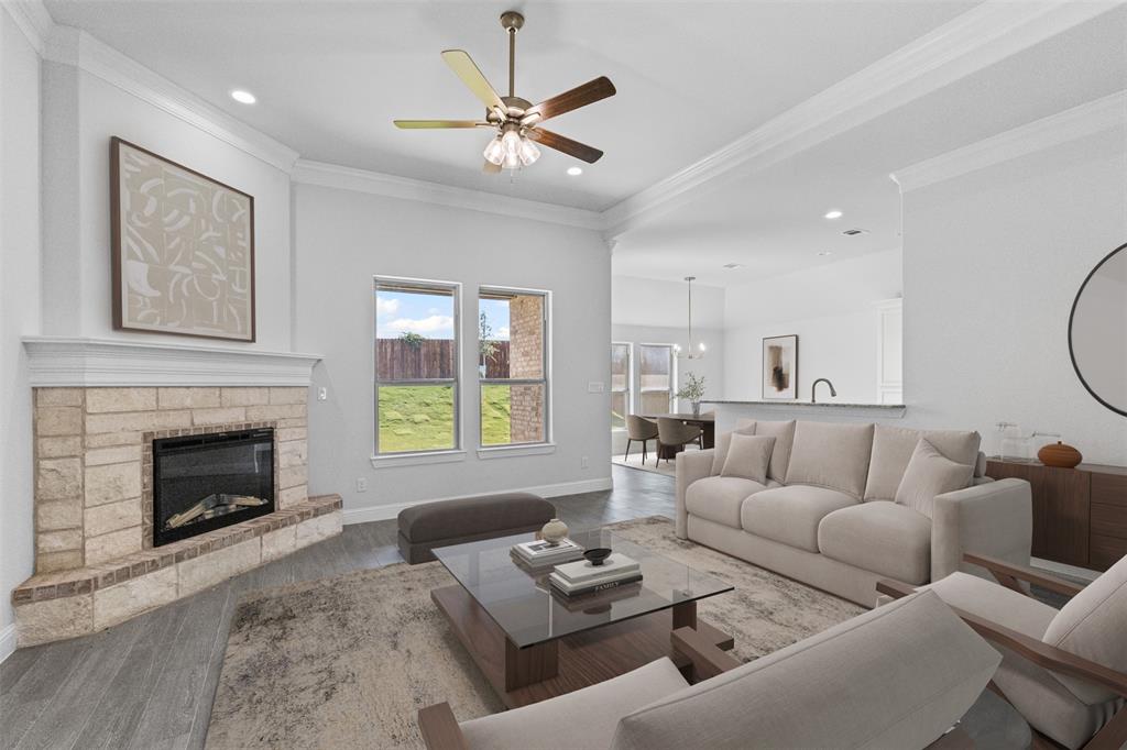 624 Jameson Springtown, TX 76082 - Photo 6 of 40 a living room with furniture a fireplace and a large window