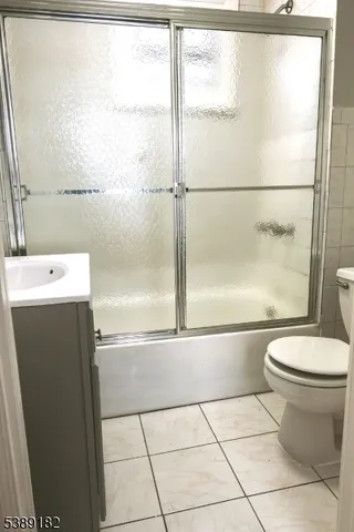a bathroom with a toilet a sink and a shower