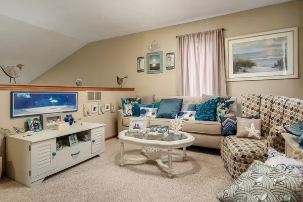 a living room with furniture and window