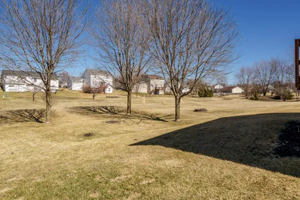 a view of a dining room with furniture and window