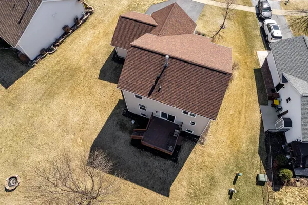 a kitchen with stainless steel appliances a sink cabinets and wooden floor