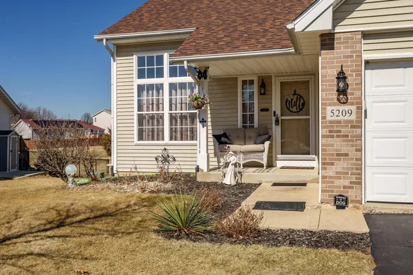 a kitchen with stainless steel appliances granite countertop a stove top oven a refrigerator and a microwave