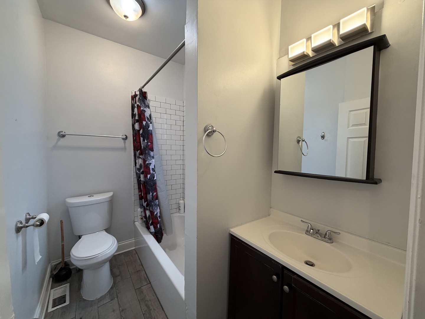 3614 West George Street, Unit 1R Chicago, IL 60618 - Photo 11 of 12 a bathroom with a toilet sink and shower