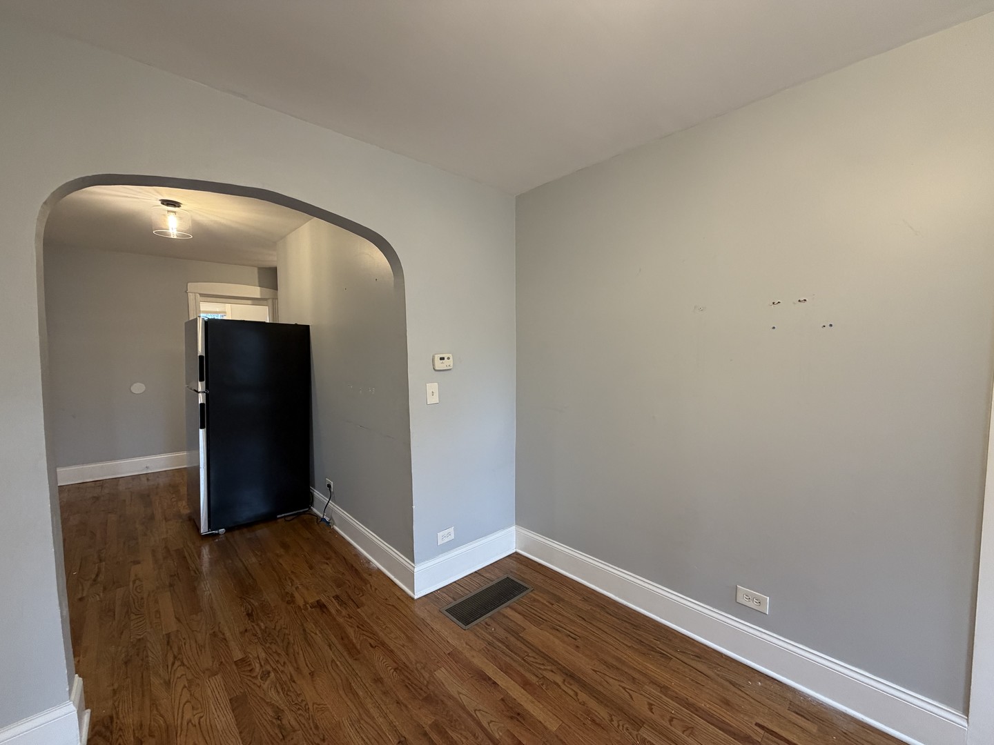 3614 West George Street, Unit 1R Chicago, IL 60618 - Photo 6 of 12 an empty room with wooden floor and closet