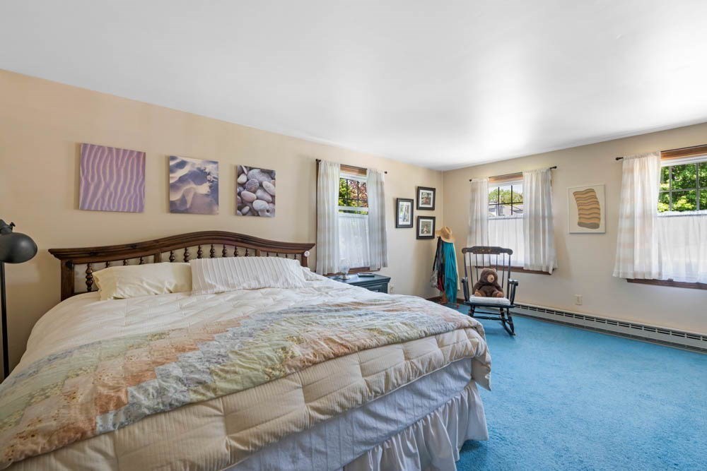 3 E Road Marblehead, MA 01945 - Photo 12 of 17 a large bedroom with a bed and a window