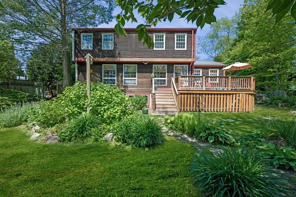 3 E Road Marblehead, MA 01945 - Photo 5 of 17 a front view of a house with a garden
