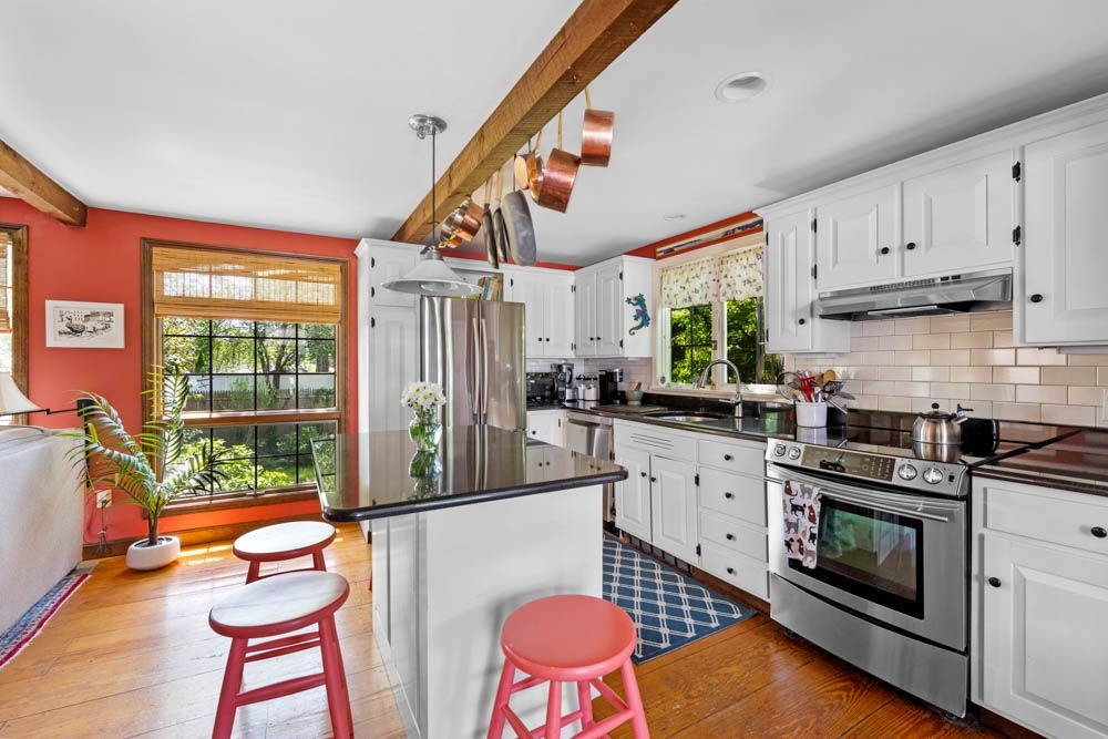 3 E Road Marblehead, MA 01945 - Photo 8 of 17 a kitchen with stainless steel appliances granite countertop a stove a sink and a refrigerator with wooden floor