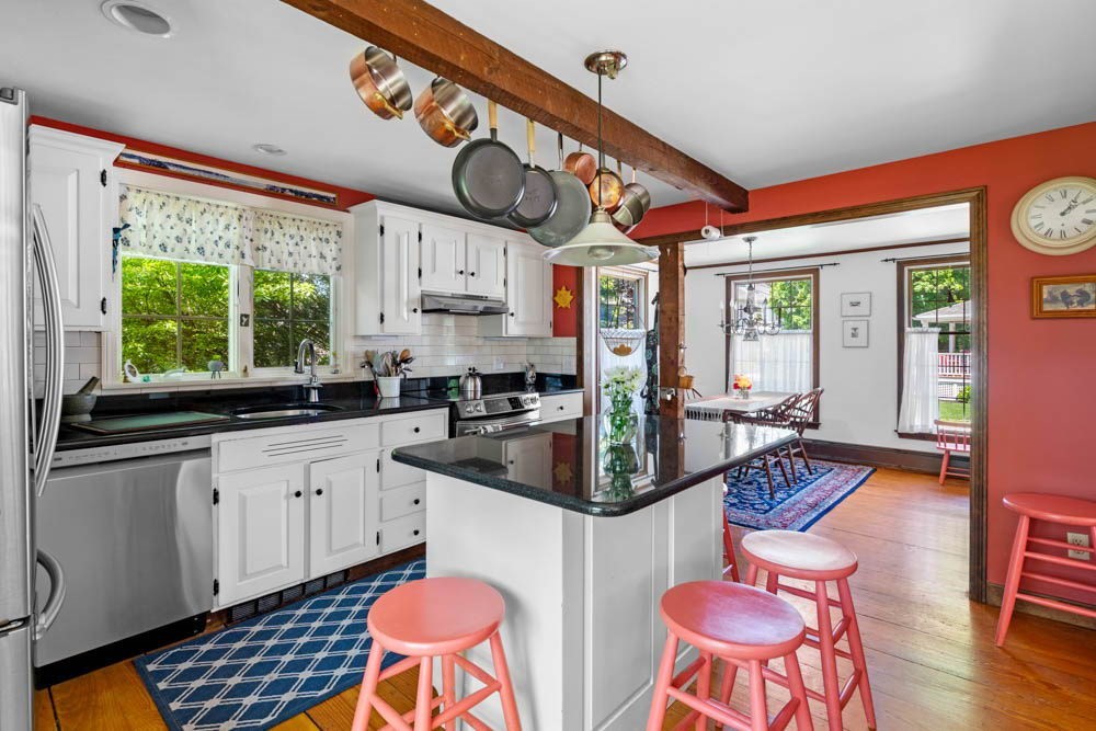 3 E Road Marblehead, MA 01945 - Photo 9 of 17 a kitchen with stainless steel appliances granite countertop a stove a sink and a microwave