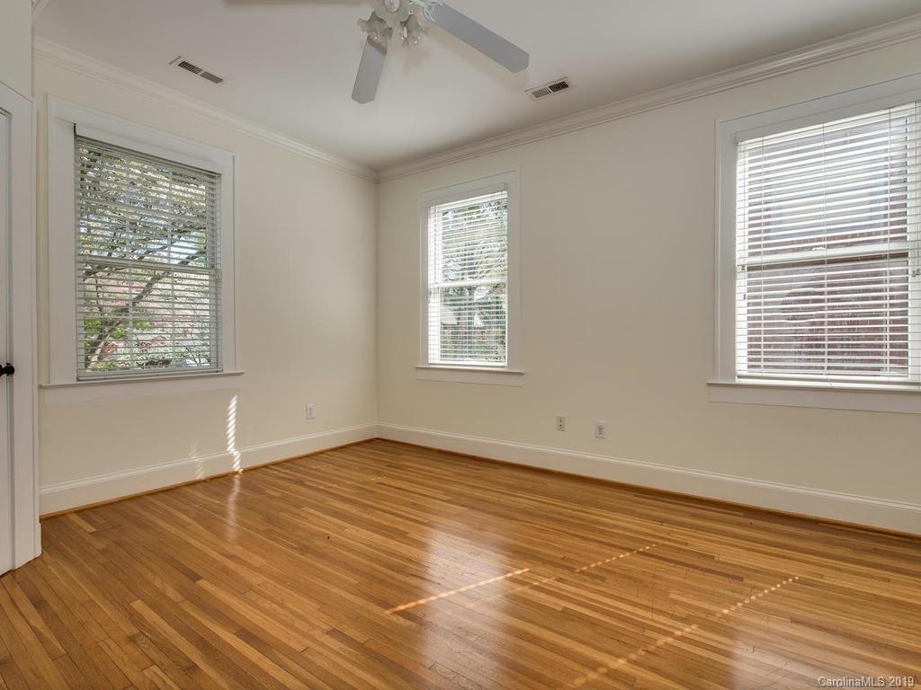 1614 Park Road Charlotte, NC 28203 - Photo 17 of 28 a view of an empty room with wooden floor and a window