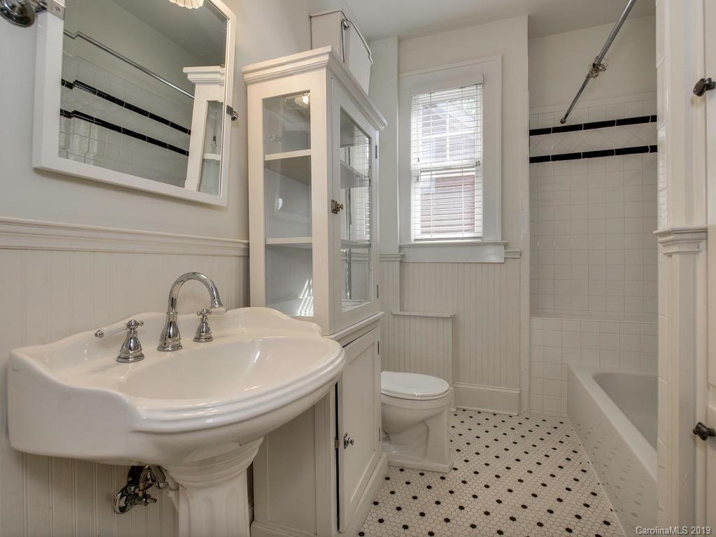 1614 Park Road Charlotte, NC 28203 - Photo 18 of 28 a bathroom with a sink a toilet and shower