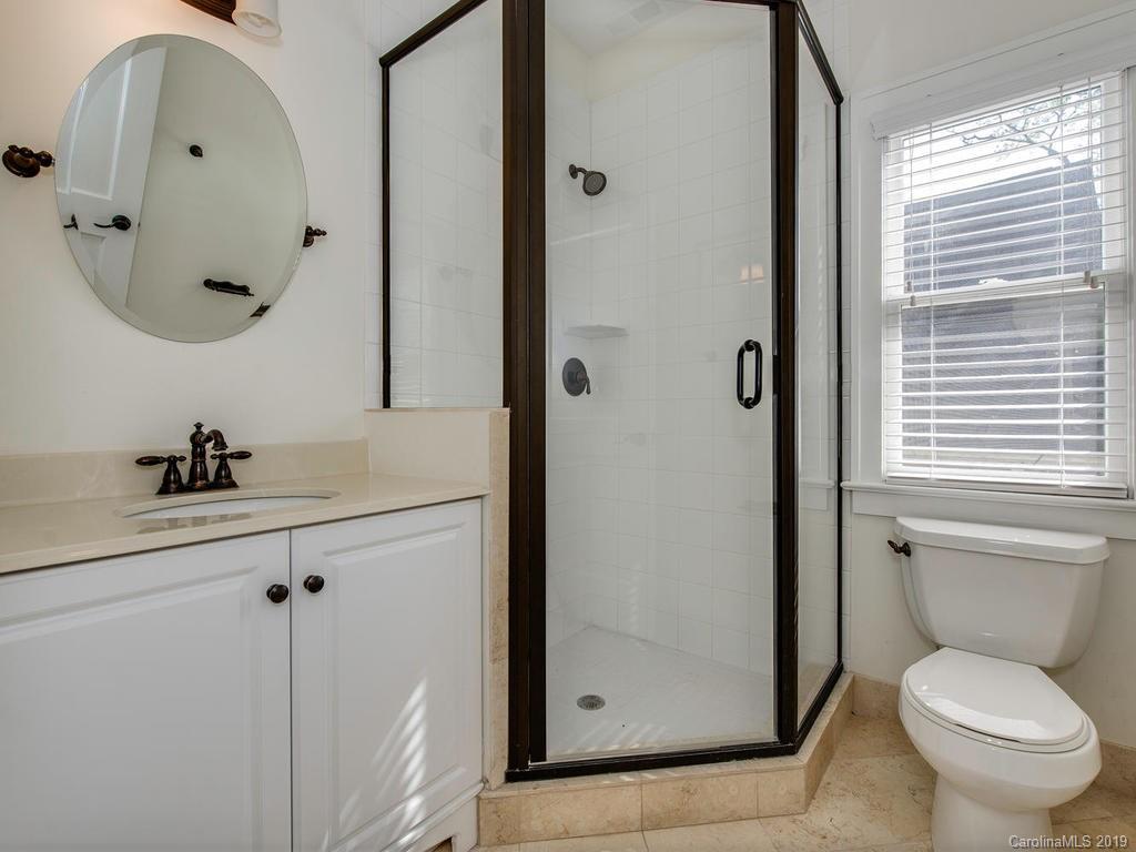 1614 Park Road Charlotte, NC 28203 - Photo 23 of 28 a bathroom with a toilet sink and mirror