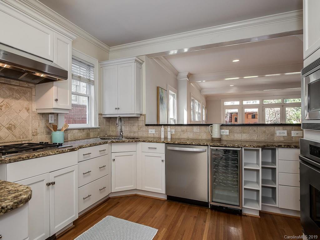 1614 Park Road Charlotte, NC 28203 - Photo 6 of 28 a kitchen with a sink cabinets stainless steel appliances and a counter top space