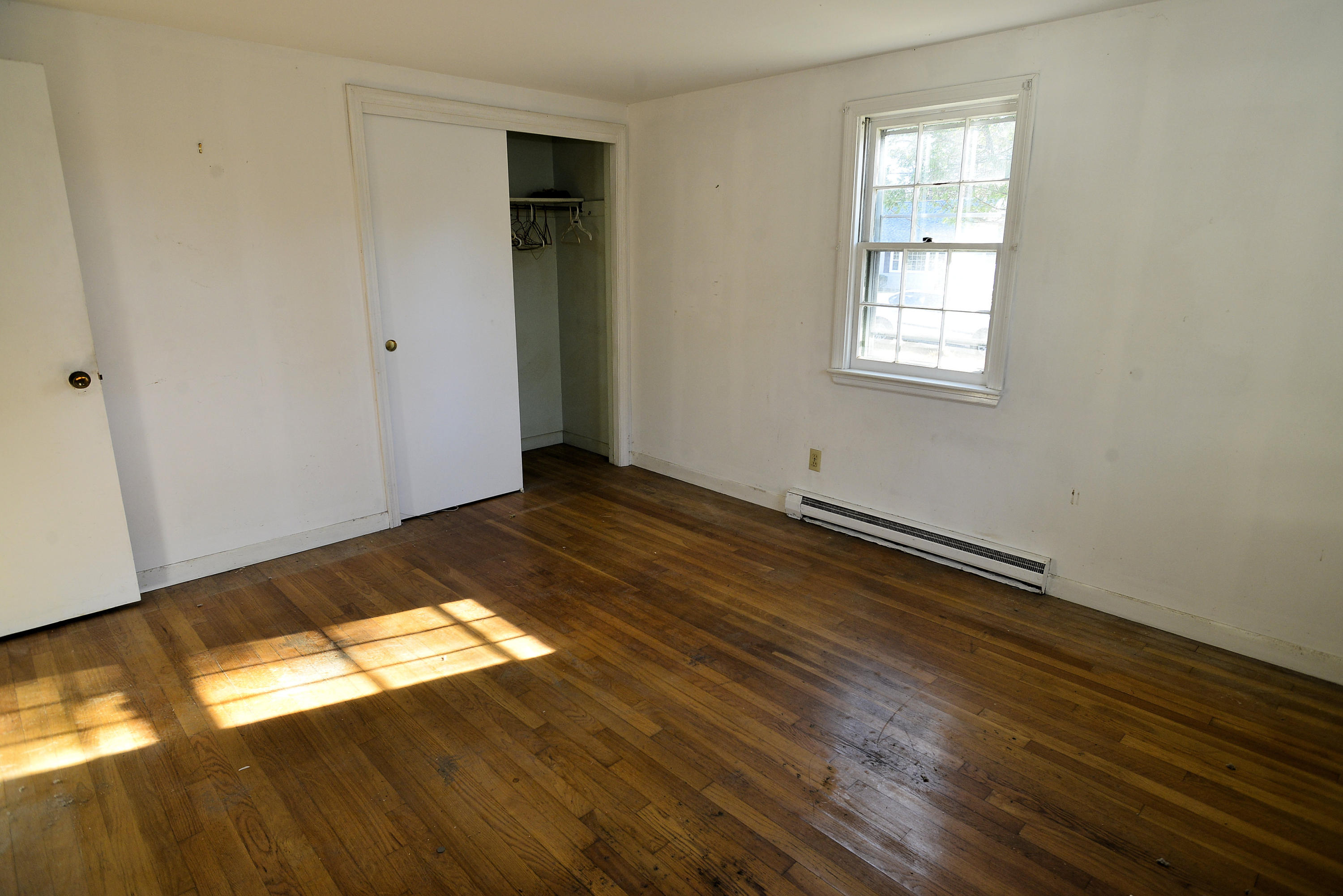 6 Captain Nickerson Road South Yarmouth, MA 02664 - Photo 13 of 20 a view of empty room with wooden floor and fan