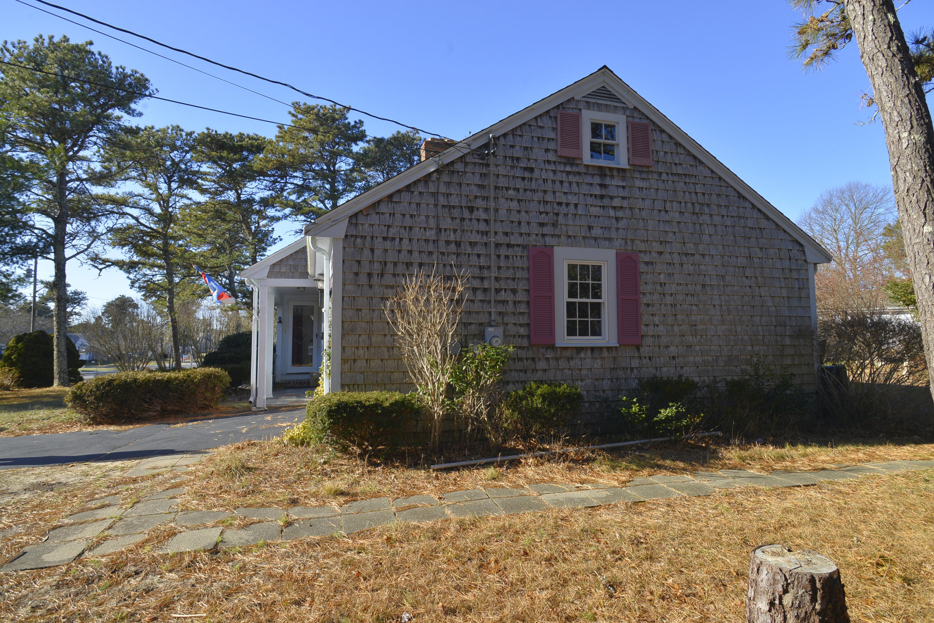 6 Captain Nickerson Road South Yarmouth, MA 02664 - Photo 2 of 20 a front view of a house with a yard