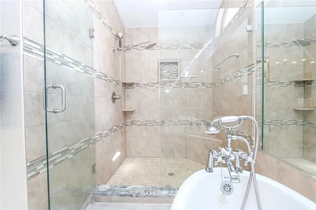 a bathroom with a shower and a sink