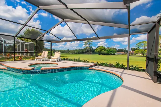 a view of a swimming pool with a patio