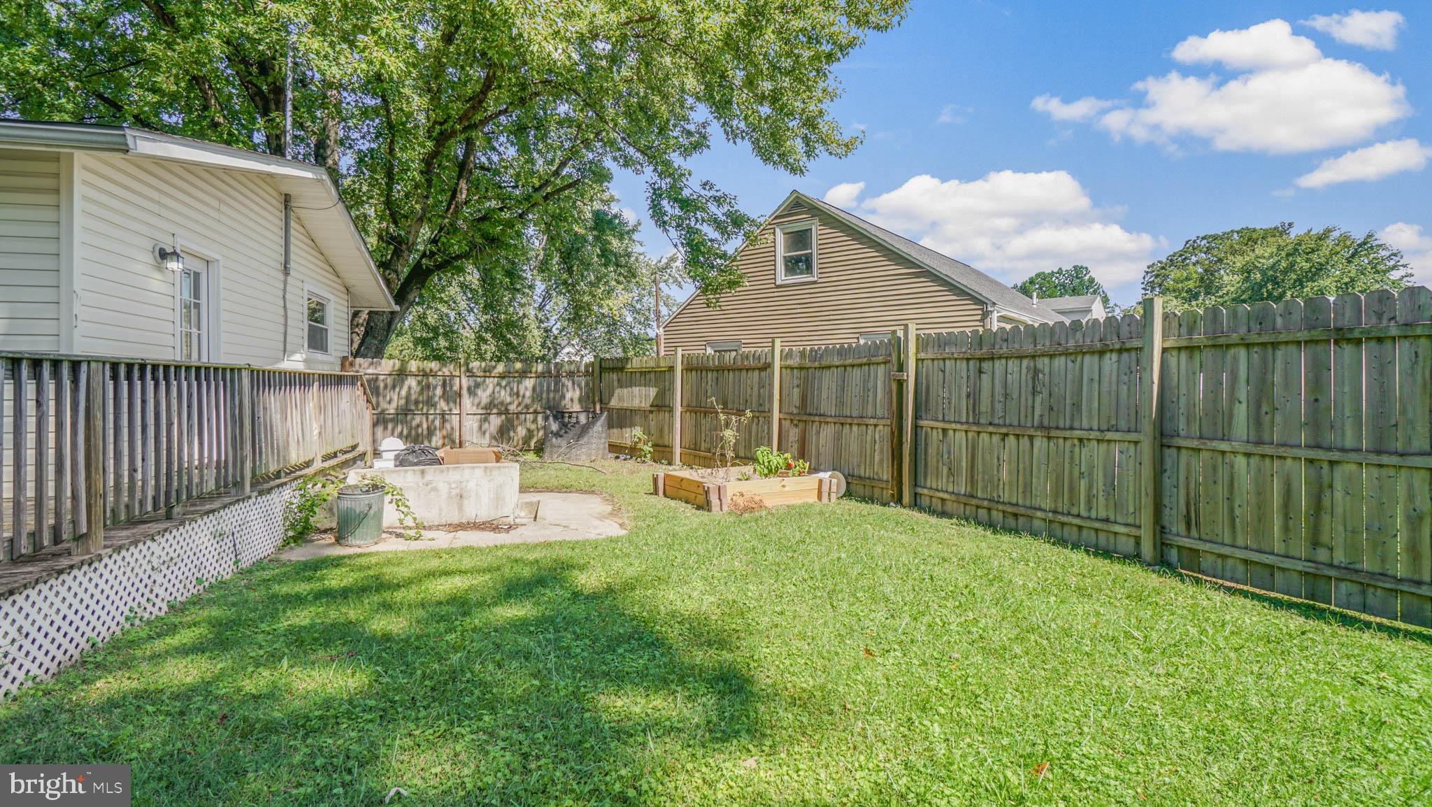 917 Oakleigh Beach Road Baltimore, MD 21222 - Photo 27 of 27 Side yard with a vegetable garden