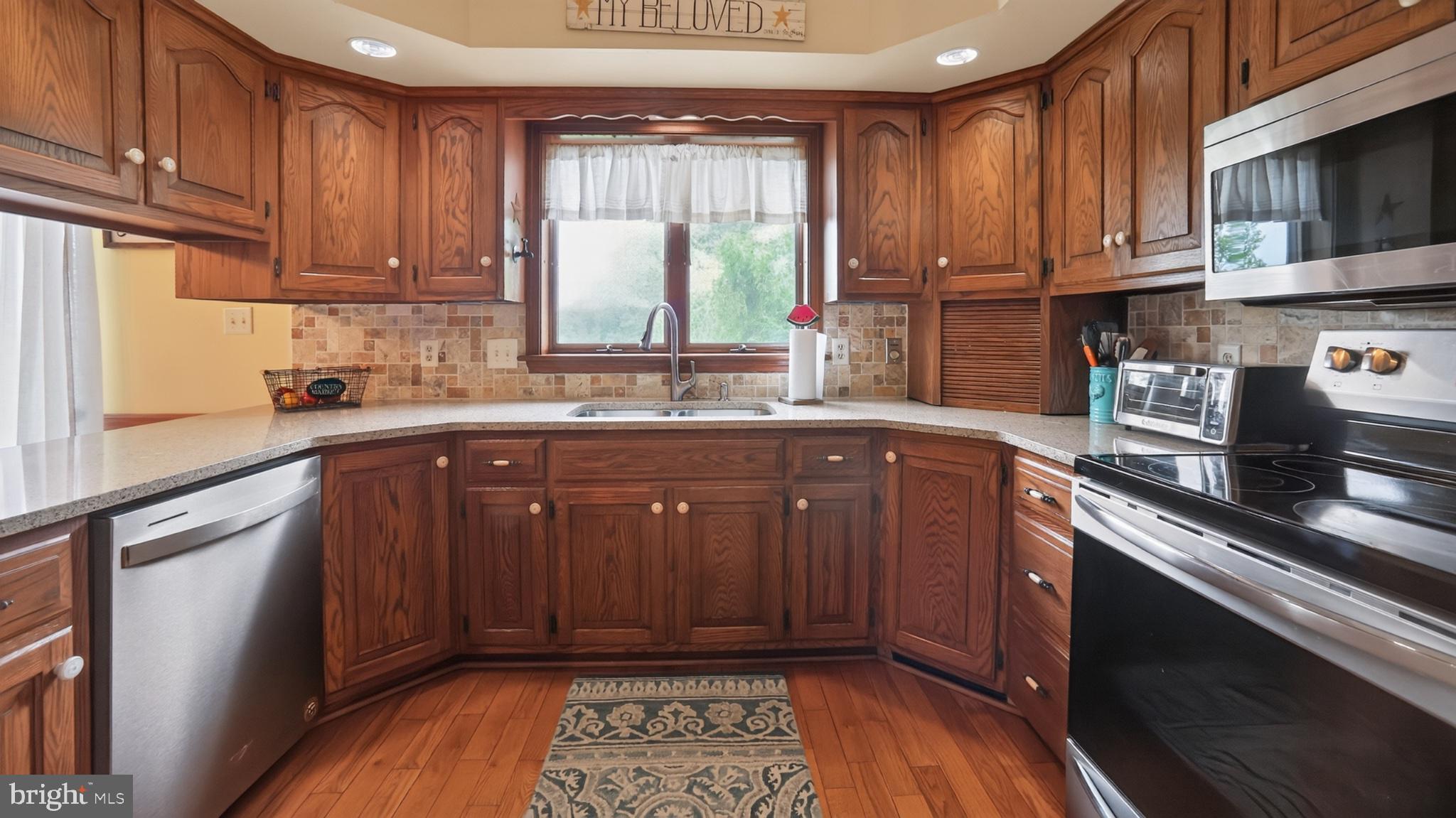 2571 Valley View Road Morgantown, PA 19543 - Photo 19 of 75 Warm wood tones in a cozy kitchen.