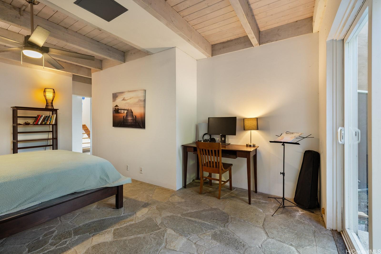 8 Prospect Street Honolulu, HI 96813 - Photo 17 of 25 a bedroom with a bed and a desk