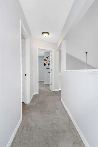 a view of a big room with closet and chandelier fan