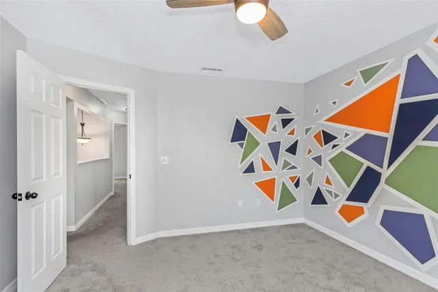 wooden floor with ceiling fan