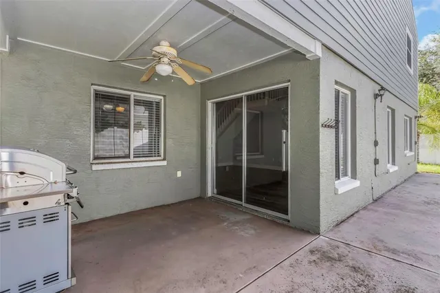 a view of wooden deck and a backyard