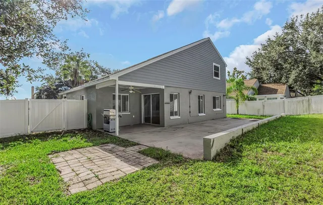 a view of a house with a yard