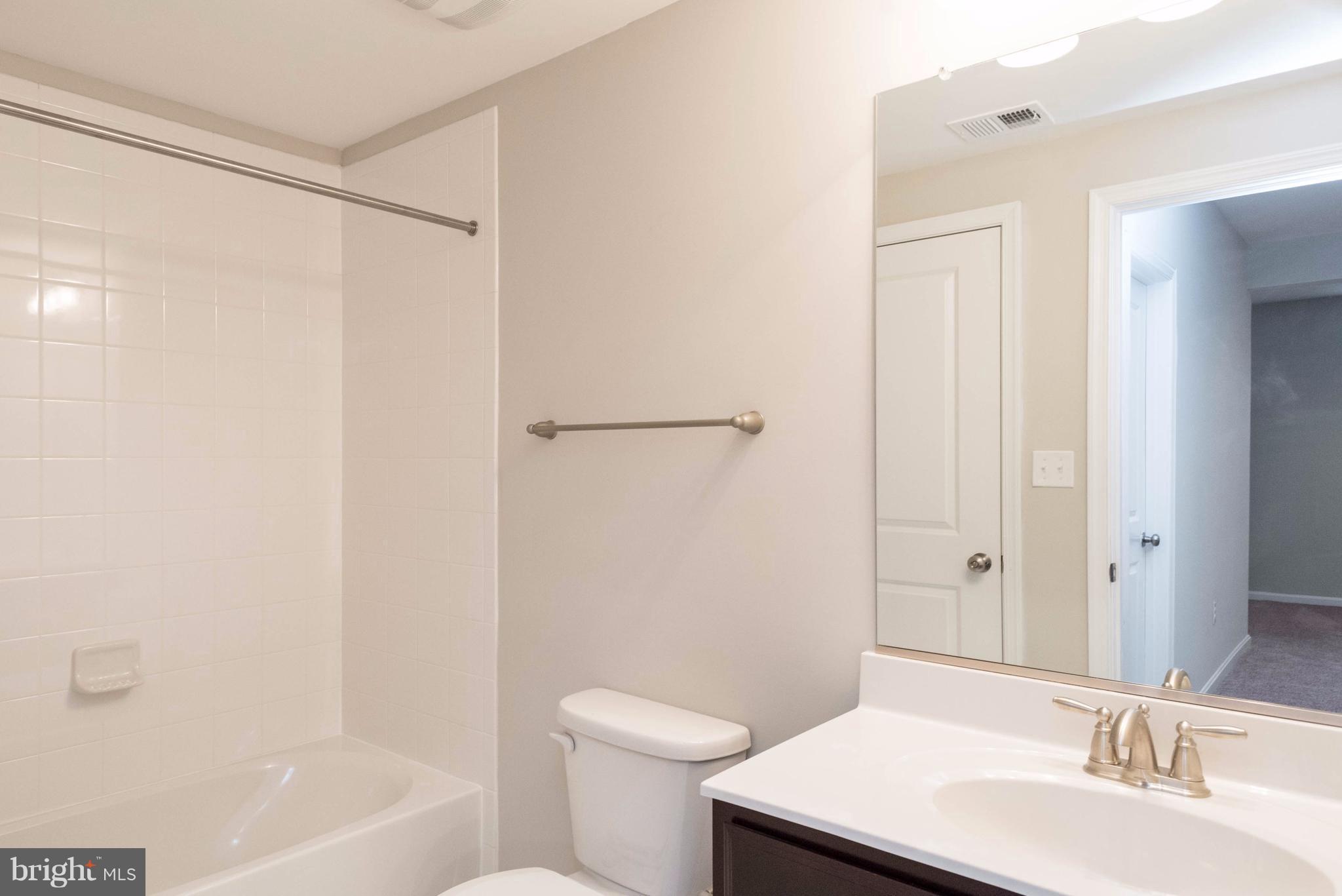 9766 Powder Hall Road Perry Hall, MD 21128 - Photo 26 of 30 a bathroom with a sink toilet and shower