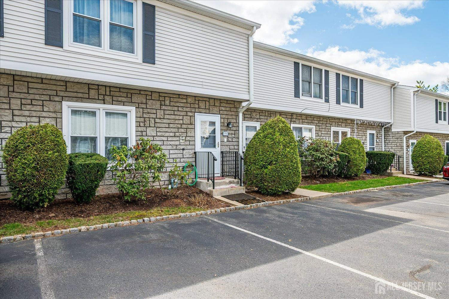 4702 Hana Road Edison, NJ 08817 - Photo 2 of 28 a view of a house with a garden