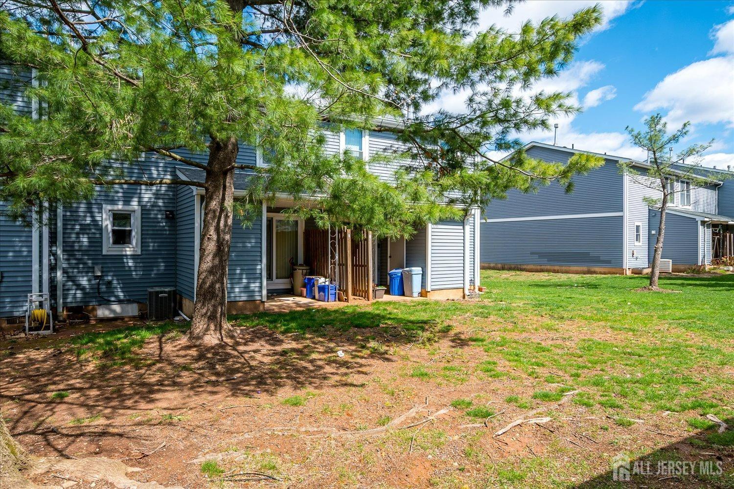 4702 Hana Road Edison, NJ 08817 - Photo 28 of 28 a front view of a house with garden